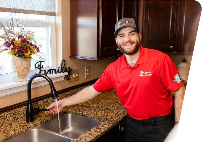 employees posing with company trucks